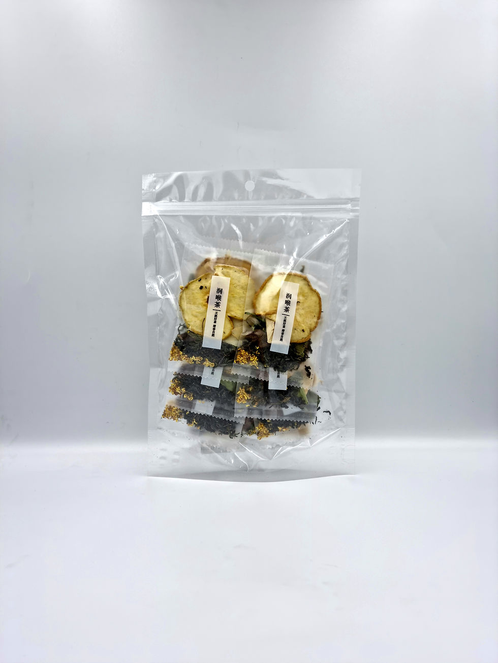 Thumbnail: throat soothing tea packs in clear ziploc packaging (front)