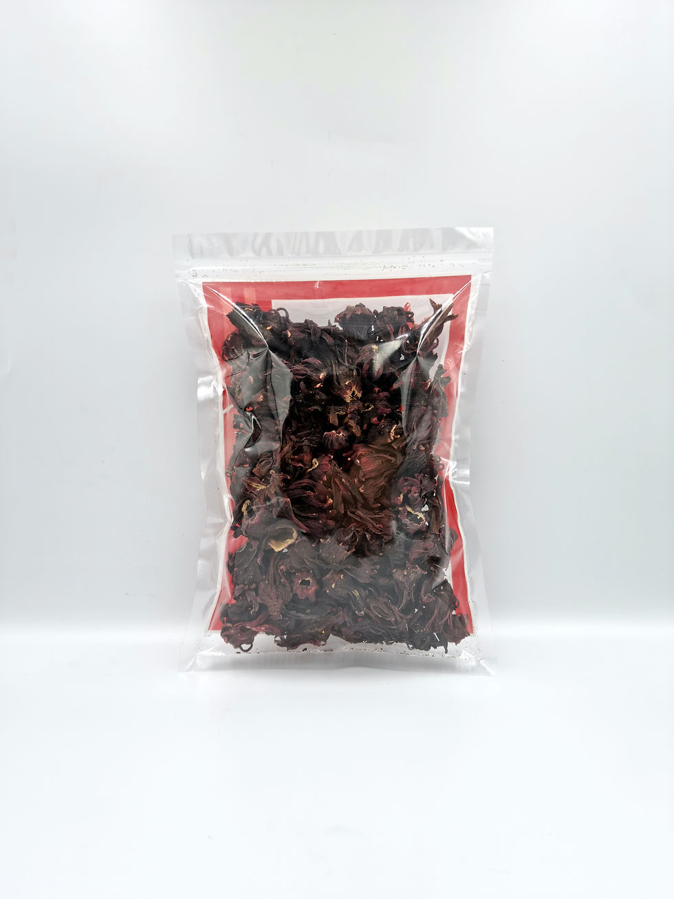 Thumbnail: Roselle loose leaf flower tea in clear ziploc packaging (front)