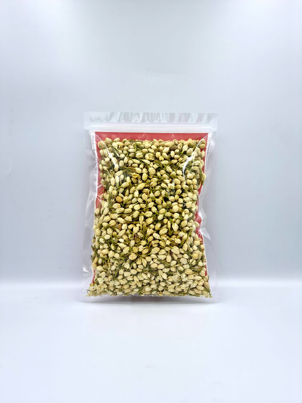 Thumbnail: Jasmine loose leaf flower tea in clear ziploc packaging (front)