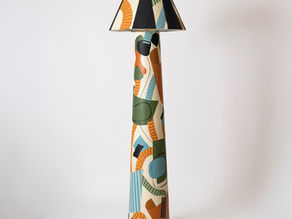 Hand-painted clay floor lamp with orange, olive and teal abstract motifs, exhibited at House of Santal in New York