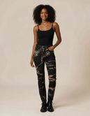 black denim jeans with bleached designs in taupe