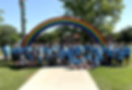 Group of attendees of the SDSBVI Family weekend standing in front of the big rainbow sculp