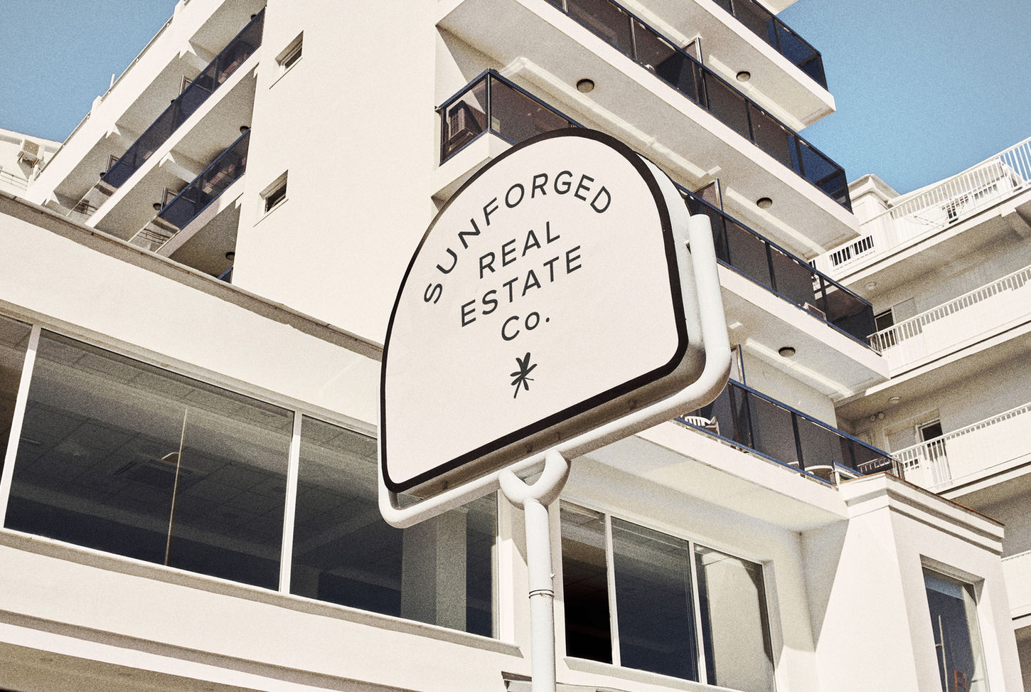 Signage, branding, and logo designed by House of Form for luxury Phoenix real estate group Sunforged.