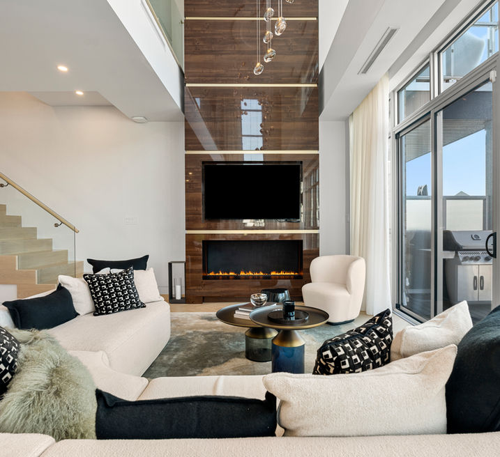 Luxurious beach house living room with wrap-around couch