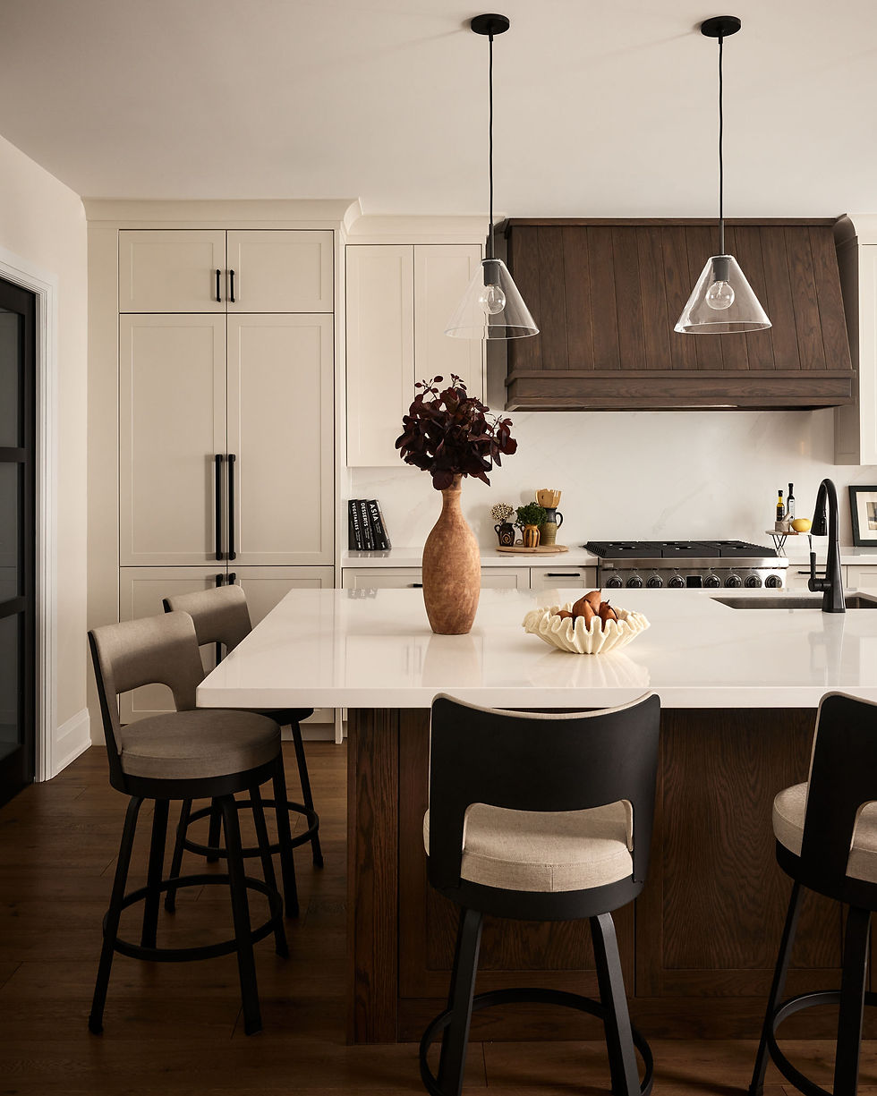 Modern transitional kitchen design with dark oak island and warm white cabinets. Bright timeless ambiance.