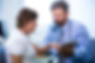 male-doctor-discussing-with-patient-digital-tablet.jpg
