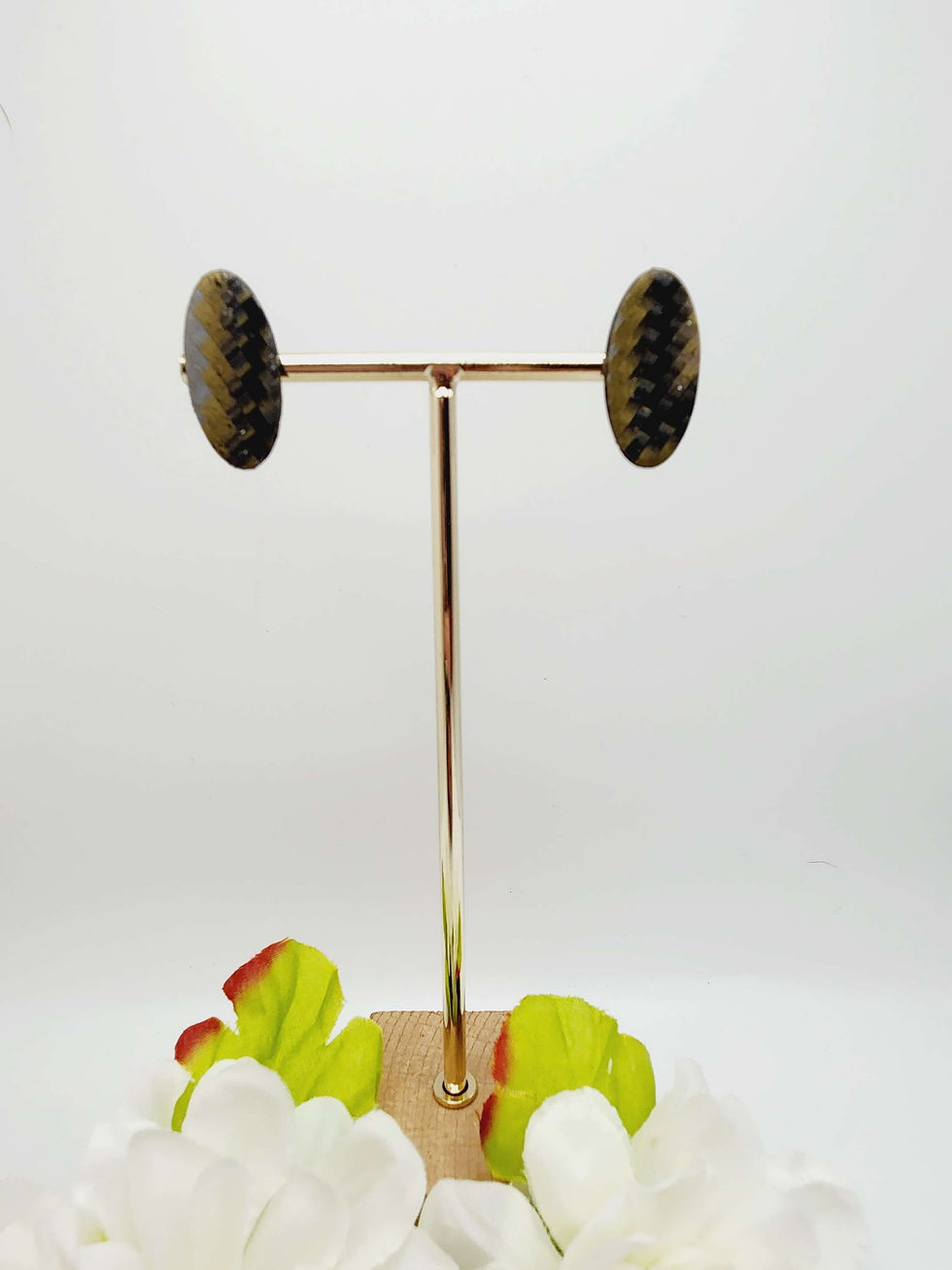 Handcrafted multicolor earrings displayed on stand