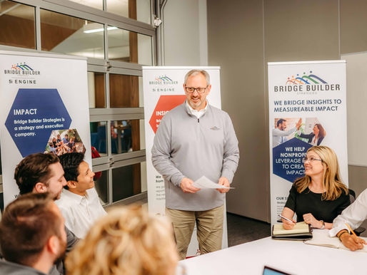 One man standing in the middle of a meeting