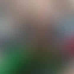 a small group of children are playing with garden peas in a Princess and a pea themed sensory tray