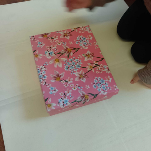 a large pink box with flower motivs on them
