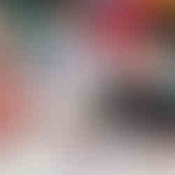 three children are exploring how to spread paint under a bubble wrap using various tools