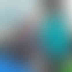 a group of small children are pulling on an expandable band held by a teacher