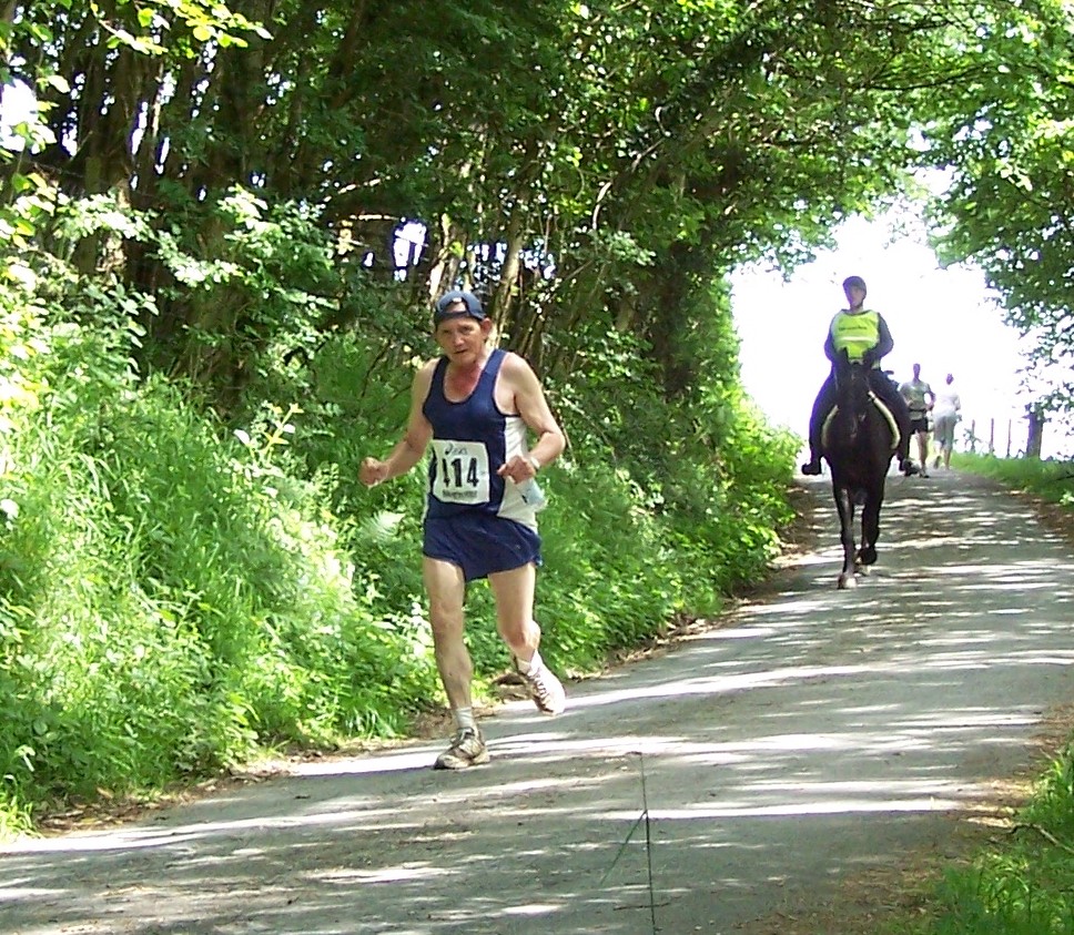 A man competing in a man-versus-horse marathon