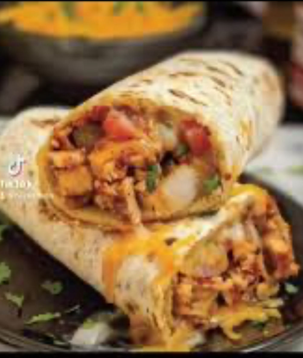 Blackened chicken Burrito with butternut squash and hot honey bacon cubes 