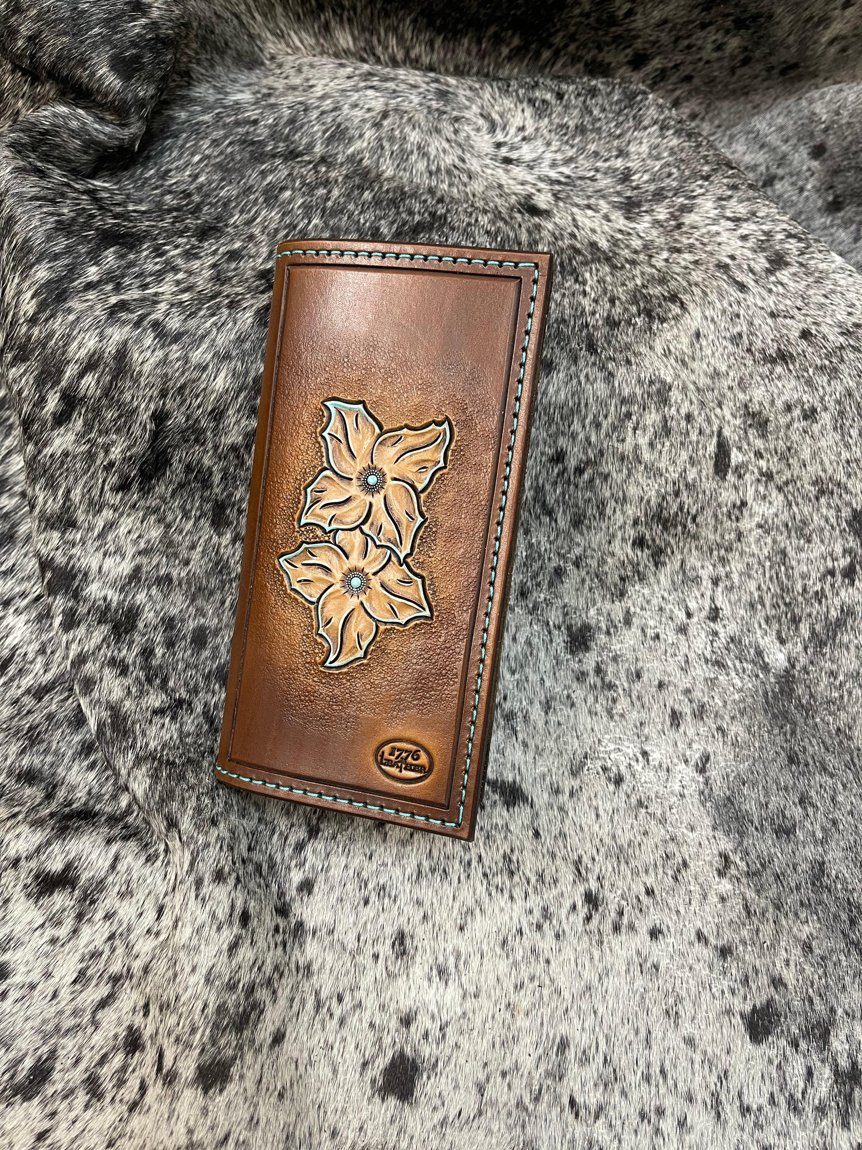 floral tooling with turquoise accents