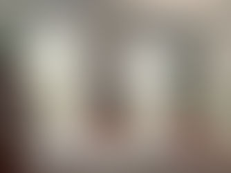 a bedroom decorated with plants and wall art with a midcentury modern style