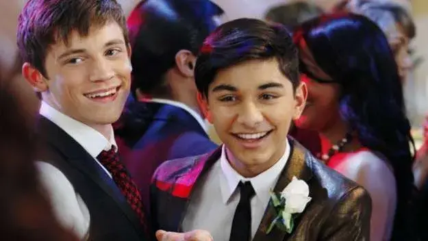 Justin Suarez dancing with boyfriend at a wedding