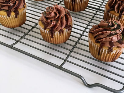 matcha latte cupcakes on a cooling rack