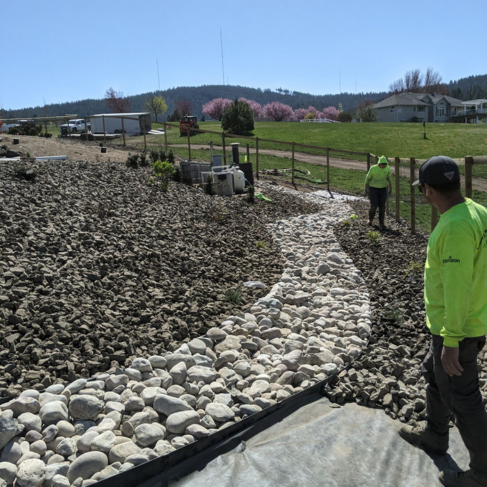 Commercial landscape installation in progress at a multifamily housing community.