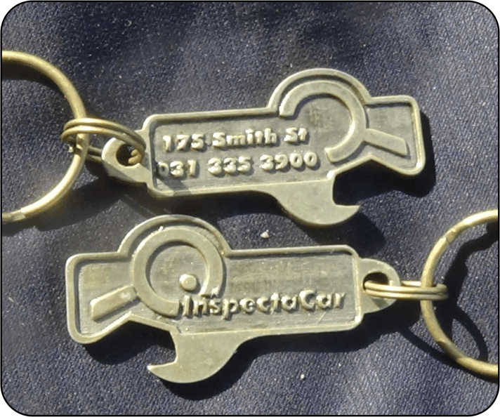 Spanner Brass Antique plating with logo engraved on one side and company information on the reverse