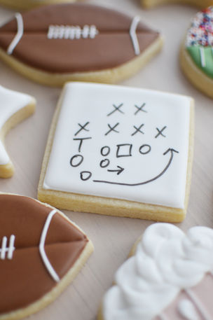 a cookie with a football play strategy drawn on it
