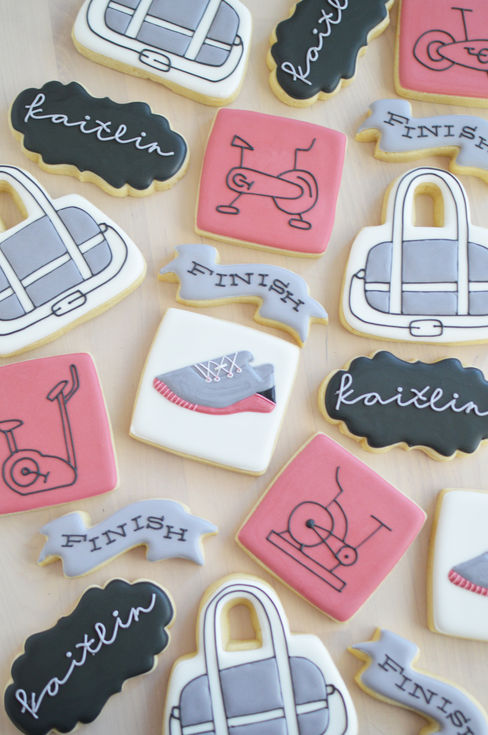 a bunch of running and sports themed cookies 