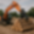 Earthmoving machine stacking timber with hydraulic grab in a neat pile