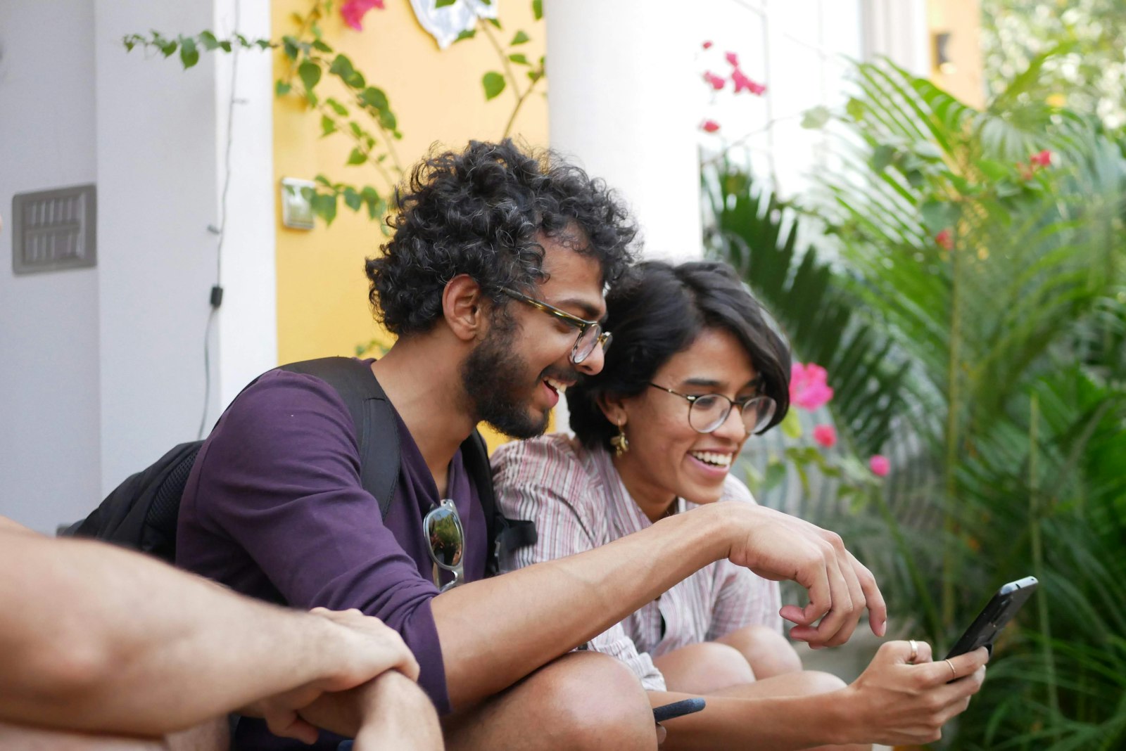 Couple reading a phone together