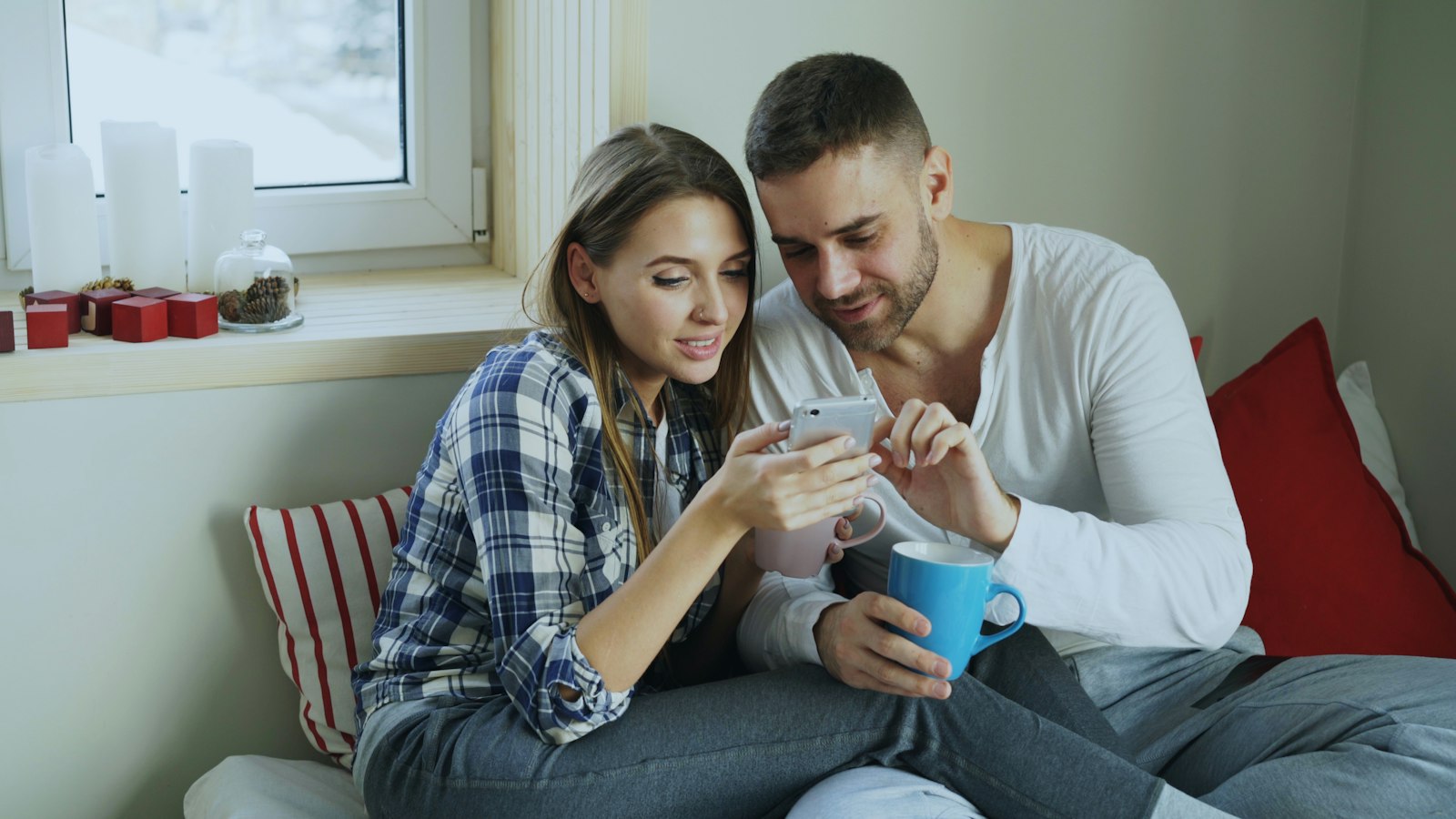 Couple reading a report together on a phone