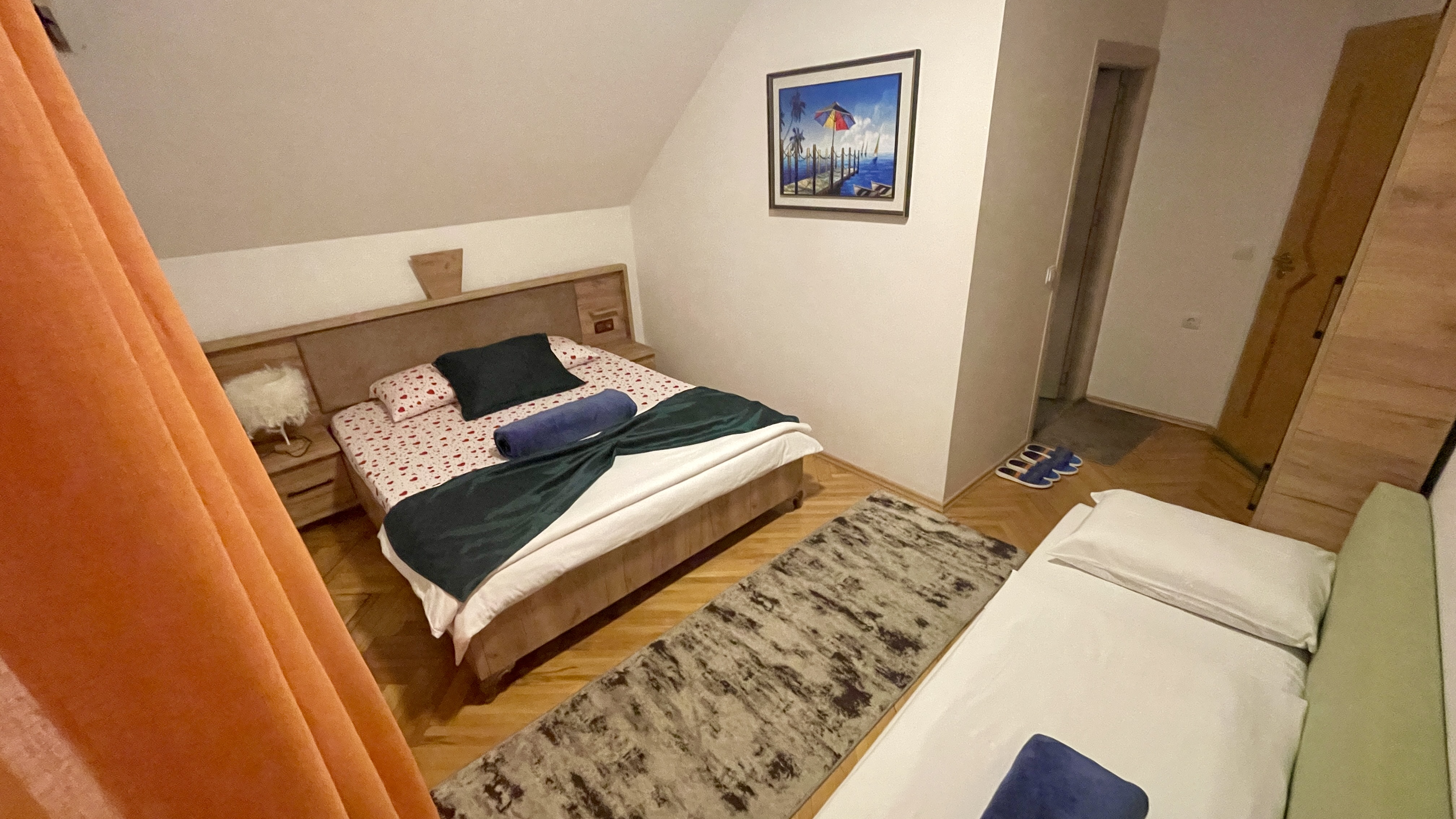 Room 202 double bed and sofa-style single bed