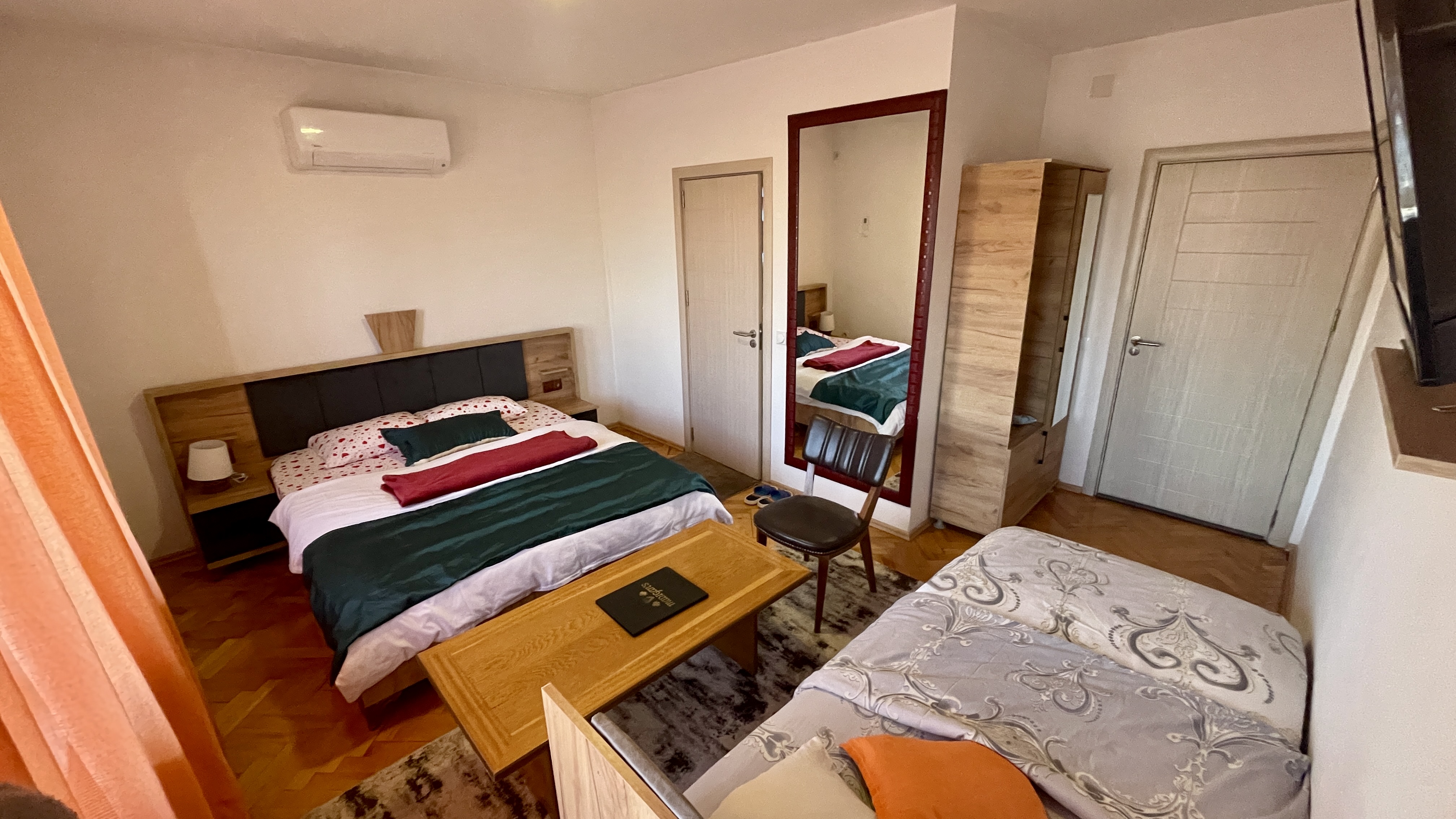 Room 103 bedroom with a double bed and a single bed