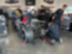 BMW LMDh car with engine cover removed.