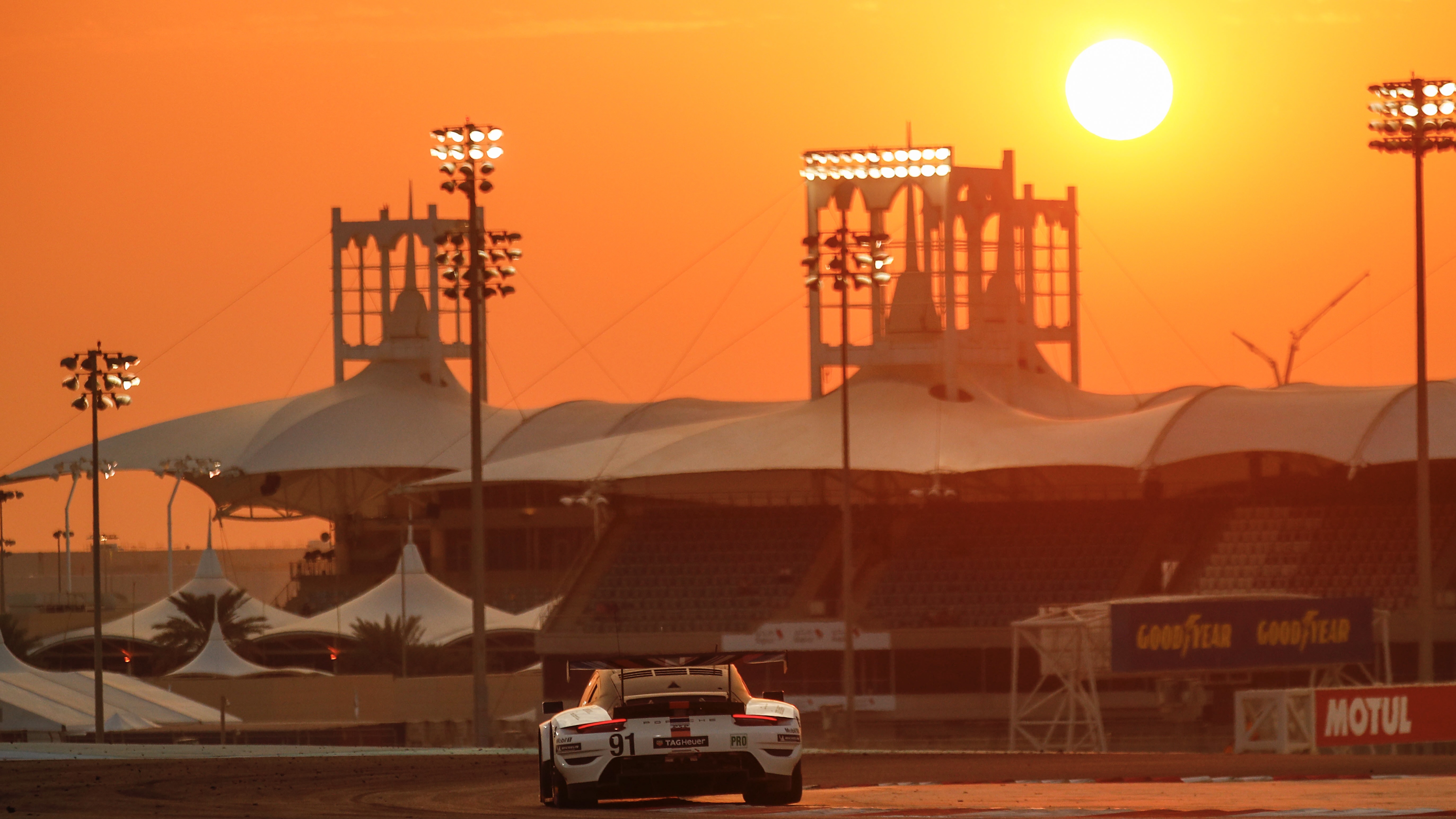 911 LMGTE cornering under sunset in Bahrain
