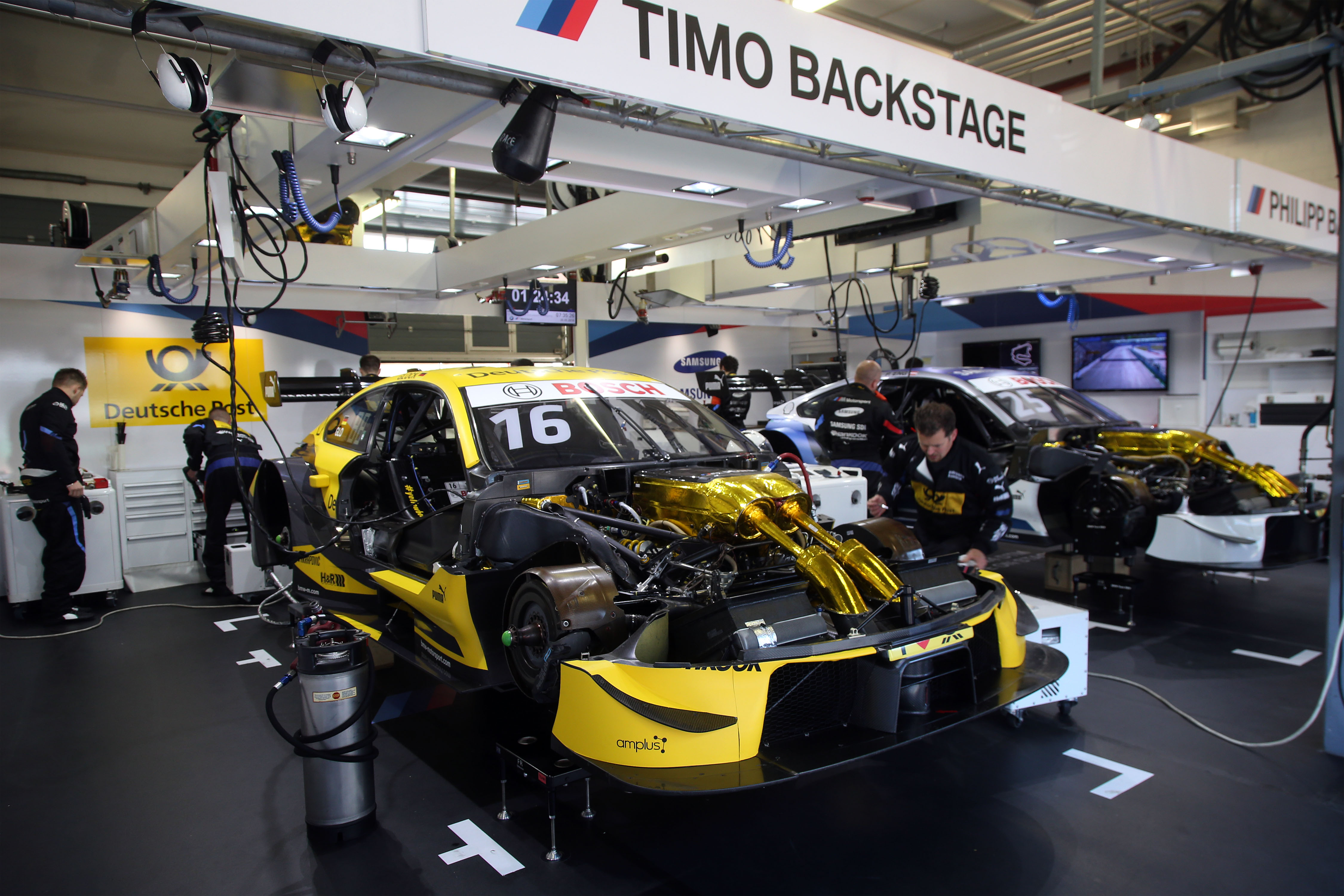 DTM racing car in action, representing a championship that benefits from rising rate suspension due to high aerodynamic loads