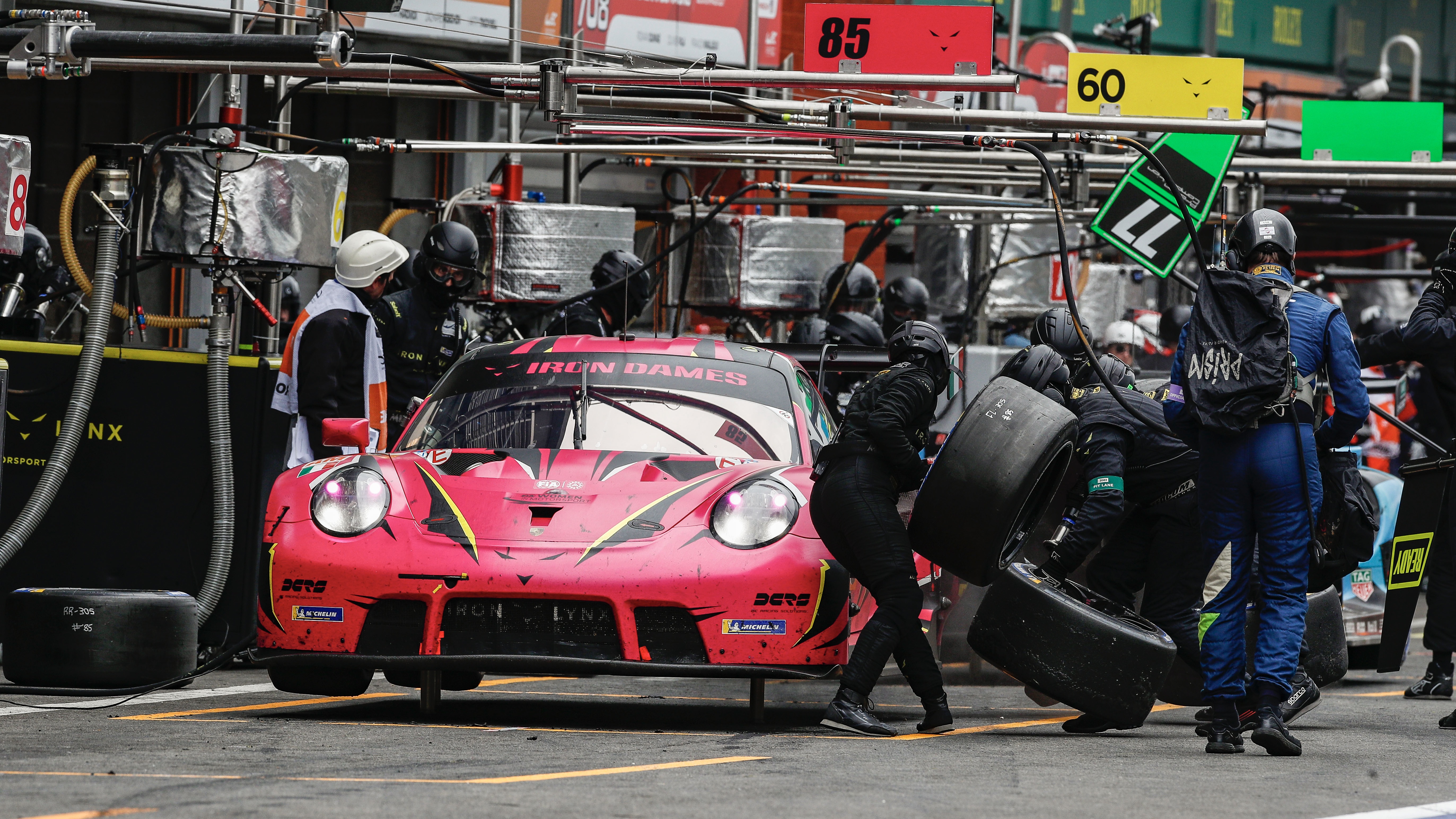 Porsche 911 GT3 R having tyres changed.