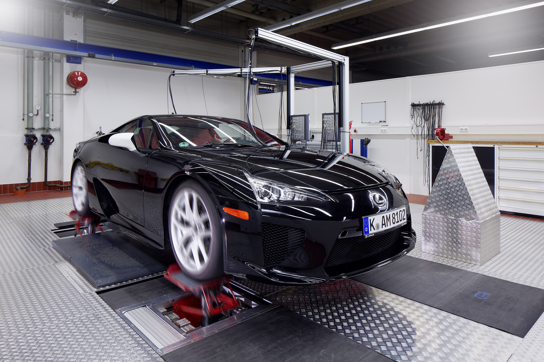 Lexus LFA on a four-post vehicle dynamics rig during suspension and handling setup