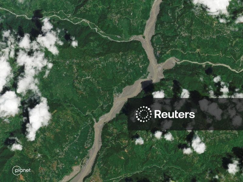 A satellite image shows Chappthoke in Nepal after flash floods and a mudslide via Planet Labs via Reuters