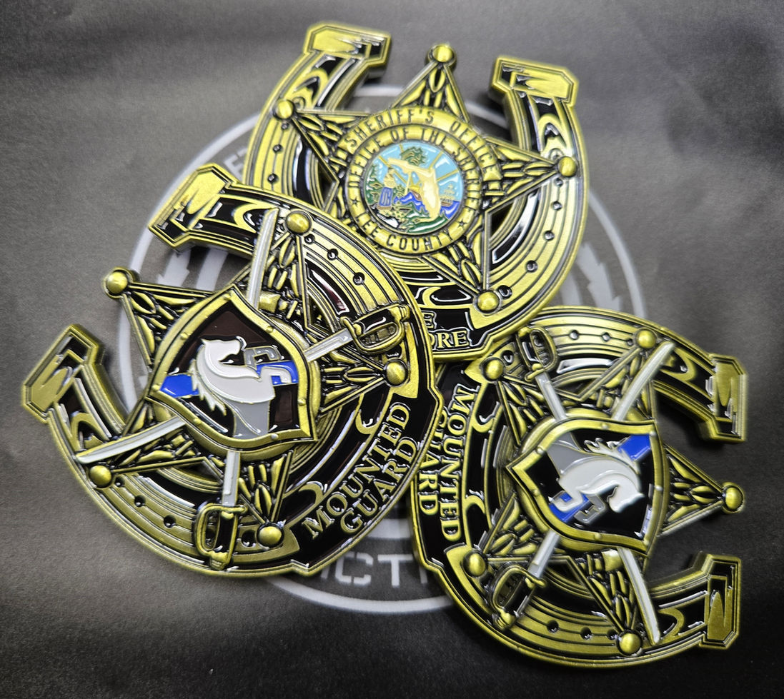 Mounted Guard emblem with horse head, crossed sabers, and laurel wreath.