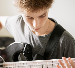 Teenger Playing Guitar