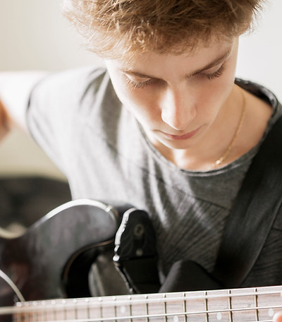 Teenger Playing Guitar