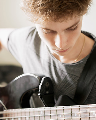 Teenger Playing Guitar