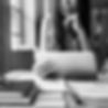 black and white image of a woman looking at a tablet