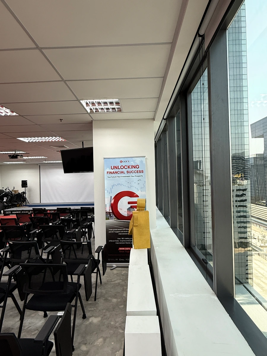 Existing GOFX seminar area used for event equipment and backdrop storage before the space was reorganised and redesigned.
