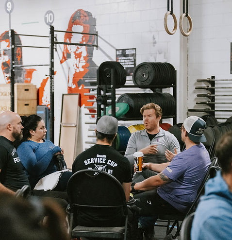 Matt sitting in a circle with other gym owners