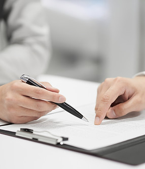 Pointing Pen And Finger On Document_edited.jpg