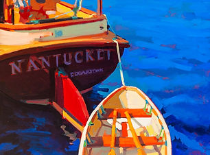 a dingy behind a boat