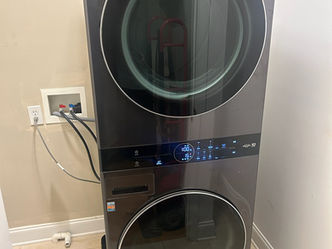 LG WashTower single-unit electric front load washer and dryer in black steel