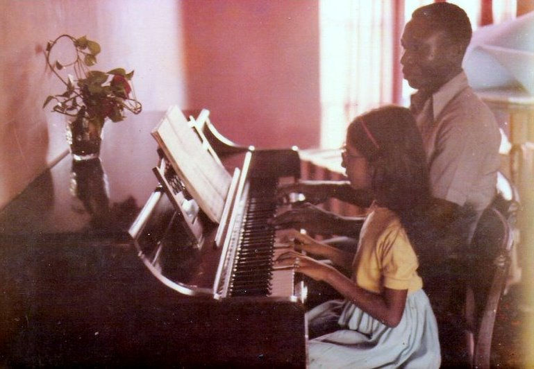 Charu with her piano teacher in Nigeria