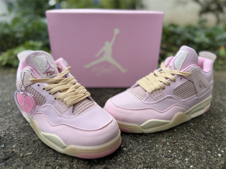 Light pink miniature Jordan 4 sneakers and box