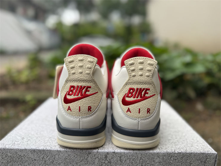 Back of two red and cream sneakers with BIKE AIR logo
